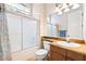 Bathroom with vanity, toilet, and shower-tub combo at 2500 S Zephyr Ave, Pahrump, NV 89048