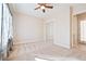Cozy bedroom with carpeted floors, ceiling fan, sliding-door closet, and great natural light at 2500 S Zephyr Ave, Pahrump, NV 89048