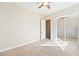 Spacious bedroom with ceiling fan, mirrored closet, and neutral colored carpet at 2500 S Zephyr Ave, Pahrump, NV 89048
