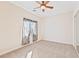 Bedroom offers neutral tones, natural light, ceiling fan, and closet with sliding doors at 2500 S Zephyr Ave, Pahrump, NV 89048