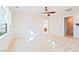 Neutral bedroom with ceiling fan and en-suite access to bathroom and large closet at 2500 S Zephyr Ave, Pahrump, NV 89048