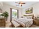 Nicely staged bedroom featuring a large window and rustic furnishings at 2500 S Zephyr Ave, Pahrump, NV 89048
