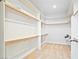Spacious walk-in closet with white shelves, carpeted floors, and ample storage space at 2500 S Zephyr Ave, Pahrump, NV 89048