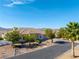 Single story home with desert landscaping and mountain views in the background at 2500 S Zephyr Ave, Pahrump, NV 89048