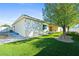 A well-maintained home features artificial grass, and a long, covered patio at 2500 S Zephyr Ave, Pahrump, NV 89048