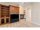 Living room featuring built-in shelving and a cozy fireplace at 2500 S Zephyr Ave, Pahrump, NV 89048
