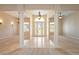 Spacious foyer featuring tile flooring, decorative columns, and a view of the entryway at 2500 S Zephyr Ave, Pahrump, NV 89048