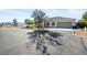 Single-story home with a large driveway and desert landscaping at 2500 S Zephyr Ave, Pahrump, NV 89048