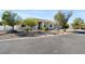 Charming single-story home with stucco exterior, arched windows, and desert landscaping at 2500 S Zephyr Ave, Pahrump, NV 89048