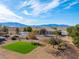 Charming front yard with mature trees, desert landscaping, and a mountain view backdrop at 2500 S Zephyr Ave, Pahrump, NV 89048