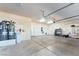 An expansive three-car garage featuring organized storage and modern appliances at 2500 S Zephyr Ave, Pahrump, NV 89048