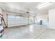 Spacious three-car garage with bright lighting, ample storage, and an insulated door at 2500 S Zephyr Ave, Pahrump, NV 89048