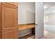 This hallway features built-in cabinets and a desk area, making it a convenient and functional space at 2500 S Zephyr Ave, Pahrump, NV 89048