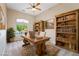 Bright office space with wooden desk, bookshelves, and a comfortable rug at 2500 S Zephyr Ave, Pahrump, NV 89048