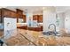 Granite countertops and a stainless steel sink complement the custom cabinets in this kitchen at 2500 S Zephyr Ave, Pahrump, NV 89048