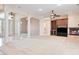 Bright living room with fireplace, built-ins, and large windows allowing natural light at 2500 S Zephyr Ave, Pahrump, NV 89048