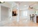 Living room with pillars, fireplace, and kitchen counter with barstools at 2500 S Zephyr Ave, Pahrump, NV 89048