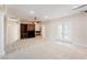 Spacious living room with fireplace, built-in cabinets, and access to the outdoor area at 2500 S Zephyr Ave, Pahrump, NV 89048