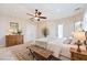 Staged main bedroom featuring a large bed, dresser, and natural lighting at 2500 S Zephyr Ave, Pahrump, NV 89048