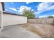 Spacious backyard with dirt and concrete at 2536 Herrod Dr, North Las Vegas, NV 89030