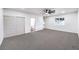 This bedroom offers a large closet, neutral carpet, and a window for natural light at 2536 Herrod Dr, North Las Vegas, NV 89030
