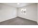 Bedroom with a window to allow natural light and neutral carpet at 2536 Herrod Dr, North Las Vegas, NV 89030