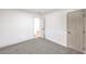 Bedroom featuring neutral walls, carpeting, and a paneled door at 2536 Herrod Dr, North Las Vegas, NV 89030