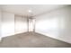 Spacious bedroom featuring a closet with white paneled doors and neutral carpeting at 2536 Herrod Dr, North Las Vegas, NV 89030