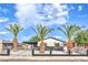 Single-story home with palm trees, white fence, carport, and fresh exterior paint at 2536 Herrod Dr, North Las Vegas, NV 89030