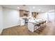 Spacious kitchen features an island with barstool seating and plenty of room for dining and entertaining at 2536 Herrod Dr, North Las Vegas, NV 89030