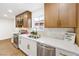 Modern kitchen with stone countertops, stainless appliances, tile backsplash, and window at 2536 Herrod Dr, North Las Vegas, NV 89030