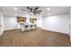 A spacious living area with a view into the modern kitchen; great for entertaining guests and Gathering at 2536 Herrod Dr, North Las Vegas, NV 89030