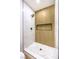 This modern shower features a rainfall shower head and contrasting tile design at 2536 Herrod Dr, North Las Vegas, NV 89030
