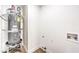 Utility room featuring new hot water heater and water connections at 2536 Herrod Dr, North Las Vegas, NV 89030