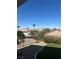 Scenic backyard view overlooking a neighborhood with palm trees and mountain views on the horizon at 2576 Chasma Dr, Henderson, NV 89044