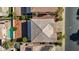 Aerial view of a home with a pool, desert landscaping, and a tile roof at 272 Violet Note St, Henderson, NV 89074