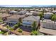 Aerial view of a backyard with a large covered patio and desert landscaping at 272 Violet Note St, Henderson, NV 89074