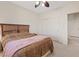 Serene bedroom features a ceiling fan, natural light, and ample closet space at 272 Violet Note St, Henderson, NV 89074