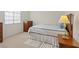 Cozy bedroom with a comfortable bed, side tables, and natural light at 272 Violet Note St, Henderson, NV 89074