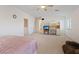Open bedroom featuring a ceiling fan, large bed, and a comfortable workstation at 272 Violet Note St, Henderson, NV 89074