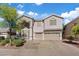 Charming two-story home with a two-car garage, manicured landscaping, and a welcoming entryway at 272 Violet Note St, Henderson, NV 89074