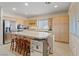 Well-equipped kitchen with island, stainless steel appliances, and ample counter space at 272 Violet Note St, Henderson, NV 89074
