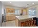Bright kitchen with island, stainless steel appliances, and plenty of cabinet storage at 272 Violet Note St, Henderson, NV 89074