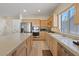 Spacious kitchen with stainless steel appliances, countertop space, and stairs in the background at 272 Violet Note St, Henderson, NV 89074