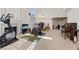 Spacious living room with a fireplace, high ceilings, and ample natural light at 272 Violet Note St, Henderson, NV 89074