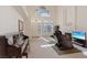 Bright living room with high ceilings, fireplace, and piano, perfect for entertaining and relaxation at 272 Violet Note St, Henderson, NV 89074
