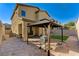 Backyard featuring a gazebo-covered patio, grill, and low maintenance landscaping at 2796 Sipe Springs St, Las Vegas, NV 89142