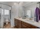 Bathroom featuring a double sink vanity and a view to the toilet and the shower/tub combo at 2796 Sipe Springs St, Las Vegas, NV 89142