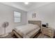 Bright bedroom with a comfortable bed, simple decor, and natural light streaming through the window at 2796 Sipe Springs St, Las Vegas, NV 89142