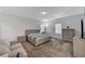 Spacious bedroom featuring carpet, a cozy couch, and a comfortable bed at 2796 Sipe Springs St, Las Vegas, NV 89142